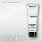 A tube of Vero K-Pak Semi-Permanent Clear Mixer hair color by Joico, displayed against a textured background of light gray hair swirled into waves. The text 'JOICO - COLOR INTENSITY' and 'Clear Mixer' are visible on the graphic.