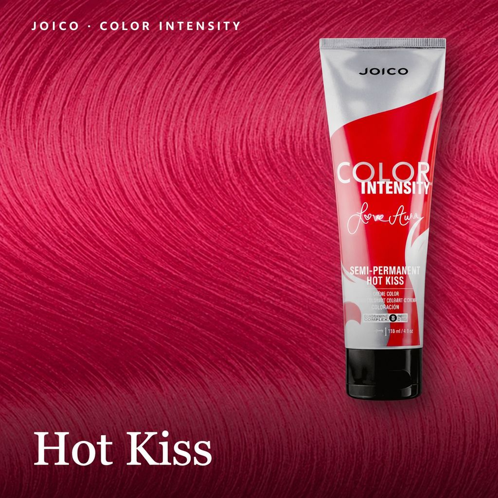A squeeze tube of Joico Color Intensity Semi-Permanent Hair Color in the shade 'Hot Kiss' is displayed against a vibrant, saturated magenta-pink hair texture background. The tube itself is white with a bold red graphic and black text.