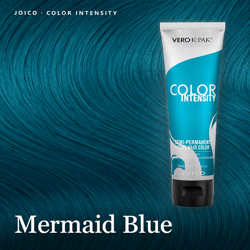 A tube of Vero K-Pak Color Intensity semi-permanent hair dye in the shade Mermaid Blue, set against a textured background of the same blue dye color.